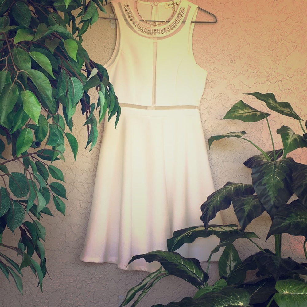 White sleeveless beaded dress with sheer cut outs